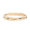 Trough Ring with Seven Sapphires - 14k Fairmined Yellow Gold Band with trough engraved throughout centre of band, featuring seven blue sapphires