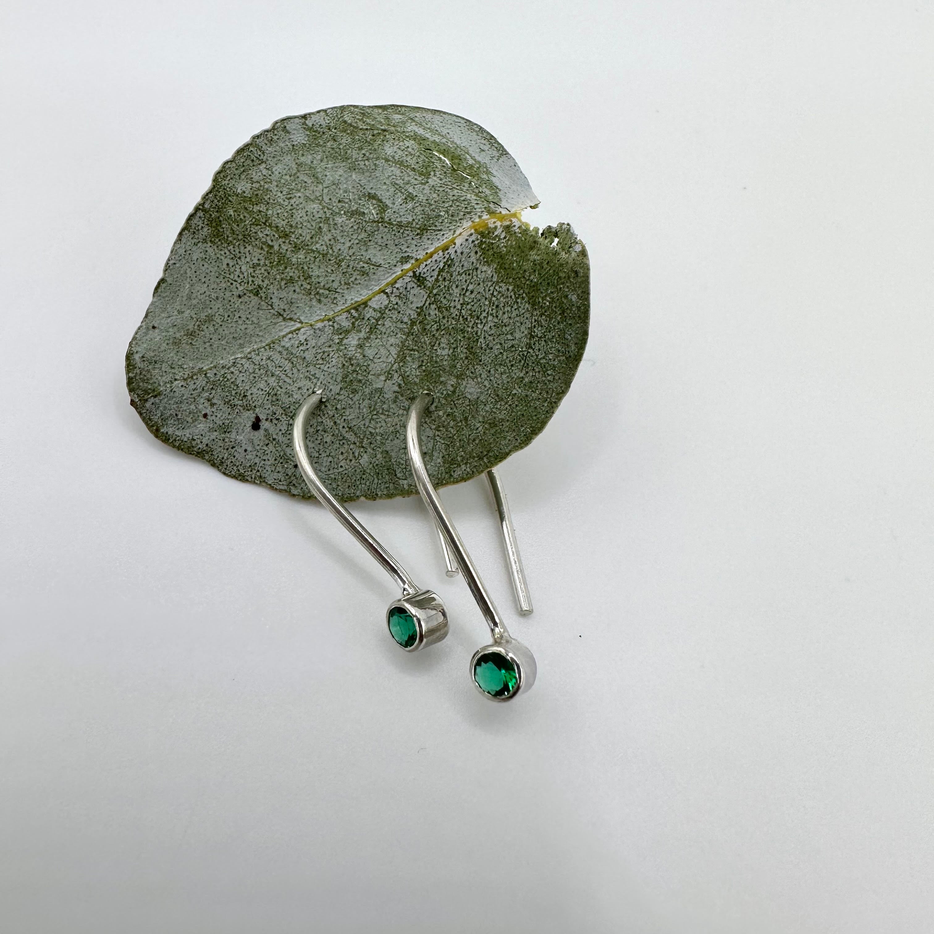 Gemstone Ear-Pins - Faceted gemstones in a bezel setting on a sleek and minimalistic pin