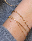 Fine Paperclip Chain Bracelet | Magpie Jewellery | Yellow Gold | On Model | Layered with Satellite and Curb Chain Bracelets