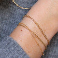 Fine Paperclip Chain Bracelet | Magpie Jewellery | Yellow Gold | On Model | Layered with Satellite and Curb Chain Bracelets