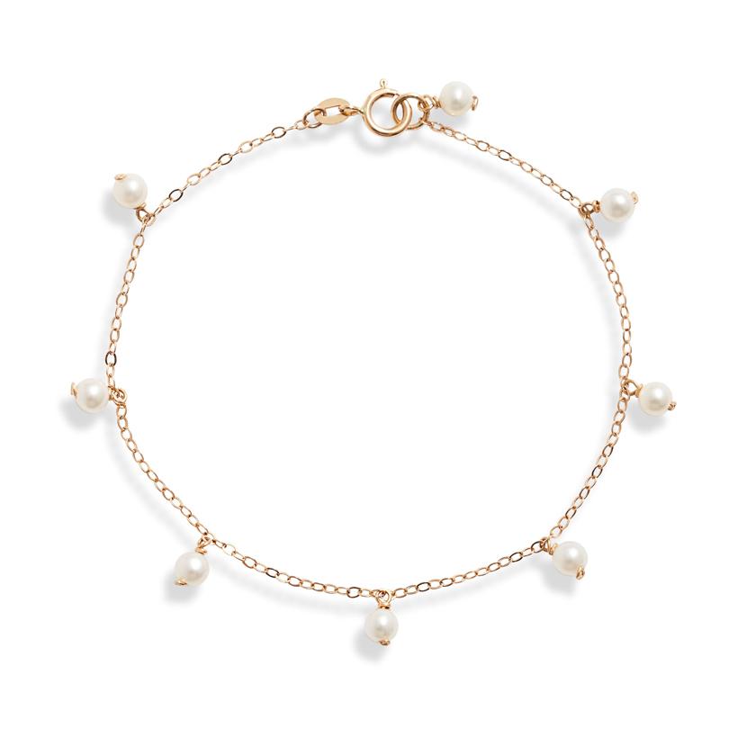 Eight dainty baby pearls dangling around a delicate 14k gold chain. 