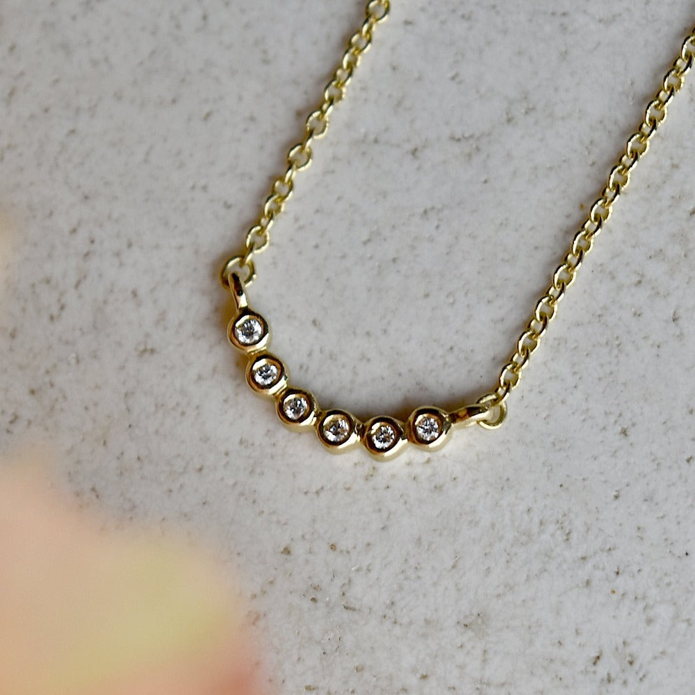 Tiny Bezel 7-Stone Crescent Necklace - Magpie Jewellery