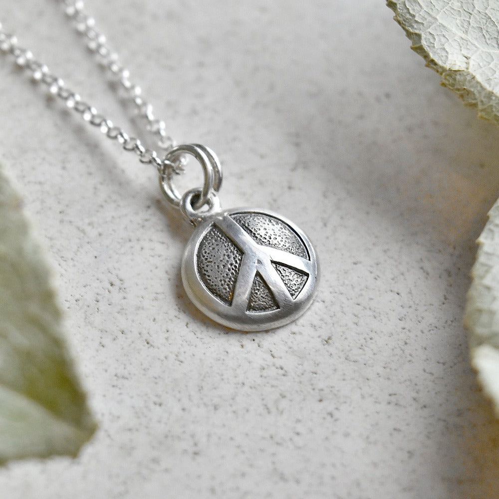 &#39;Peace&#39; Tiny Die Struck Silver Necklace - Magpie Jewellery