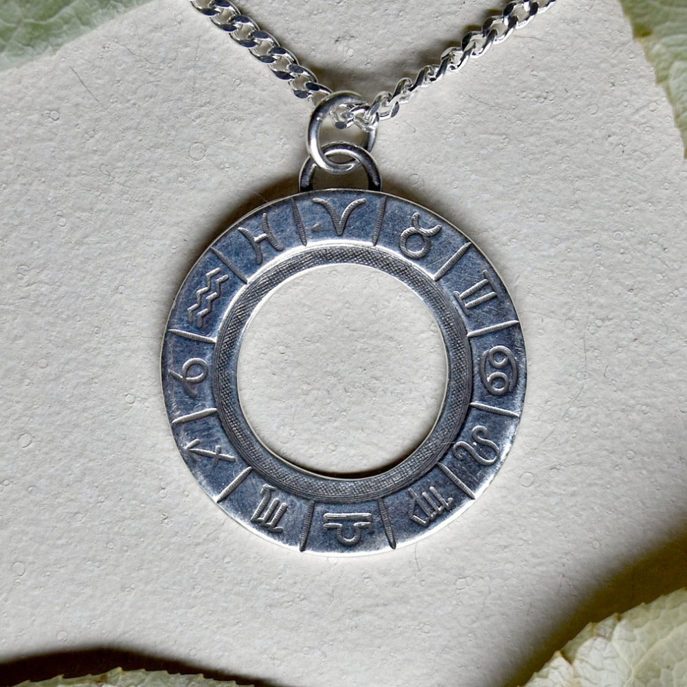 &#39;Zodiac Cycle&#39; Die Struck Silver Necklace - Magpie Jewellery
