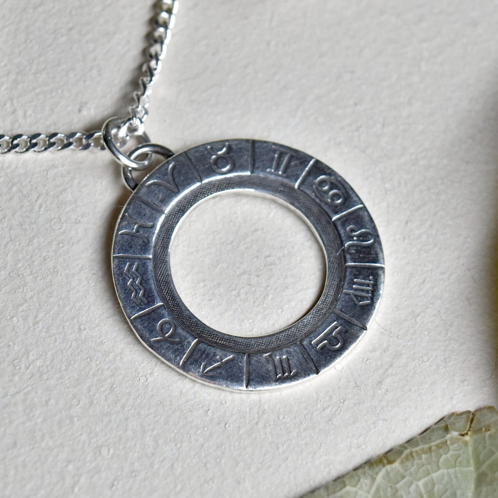 &#39;Zodiac Cycle&#39; Die Struck Silver Necklace - Magpie Jewellery