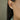 Pearl studs with a vibrant Emerald nested along the side of two lustrous pearls creating cluster pearl earrings | on model