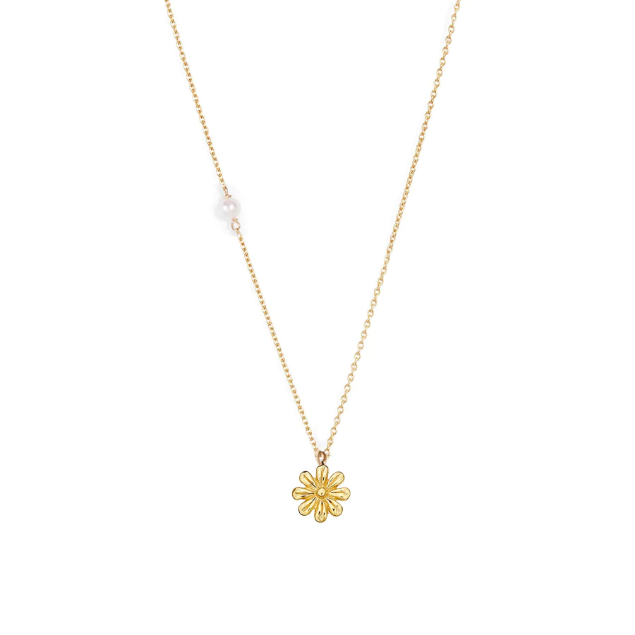 A Daisy pendant on a dainty gold chain with a little pearl detail on the side