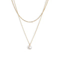 Two 14-karat gold chains layered together with a sweet lustrous white pearl pendant. 