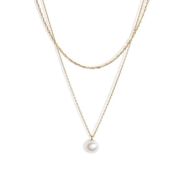 Two 14-karat gold chains layered together with a sweet lustrous white pearl pendant. 