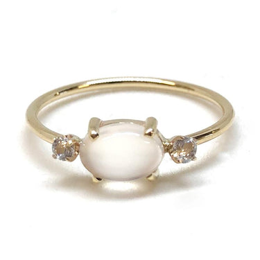 An oval-shaped 0.85ct genuine moonstone cabochon ring with wo dazzling diamond accents