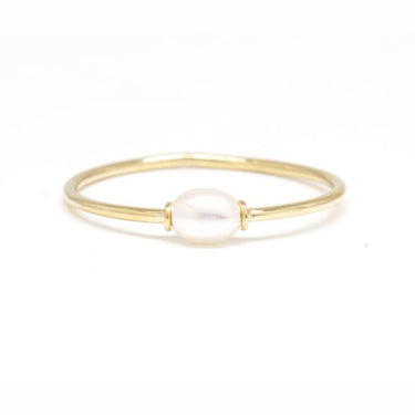 14k Yellow skinny gold ring with a sweet petite oval shaped pearl in the center.