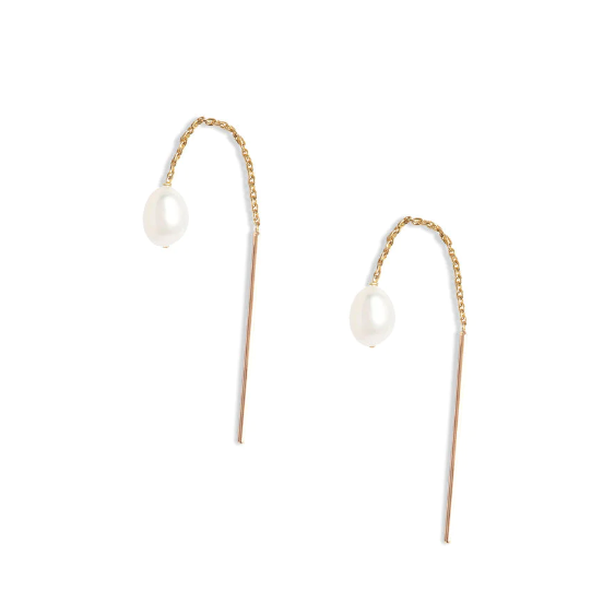 A pull through earring style featuring a pair of lustrous petite oval shaped pearls 