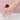 14-karat gold ring showcasing a  prong-set oval-shaped genuine Ruby gemstone with three iamonds. | on model