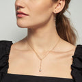 A round pearl anchors this pull through style necklace handcrafted in a contrast of twisted rope and box chains | on model