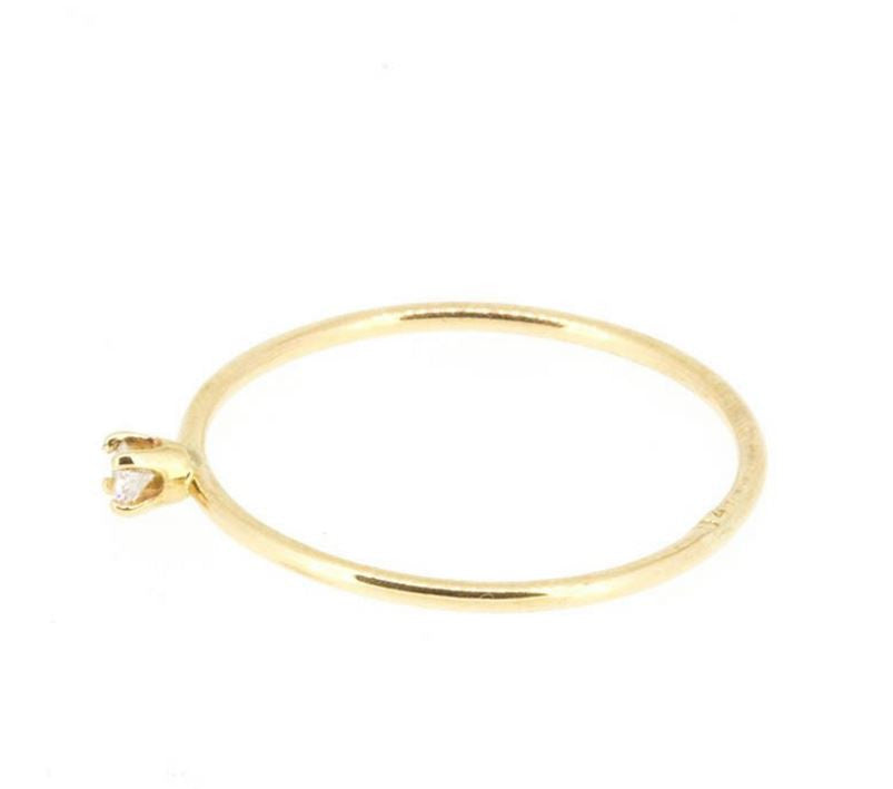 This ring features a small 2mm brilliant-cut diamond set on a slim 14K recycled gold band