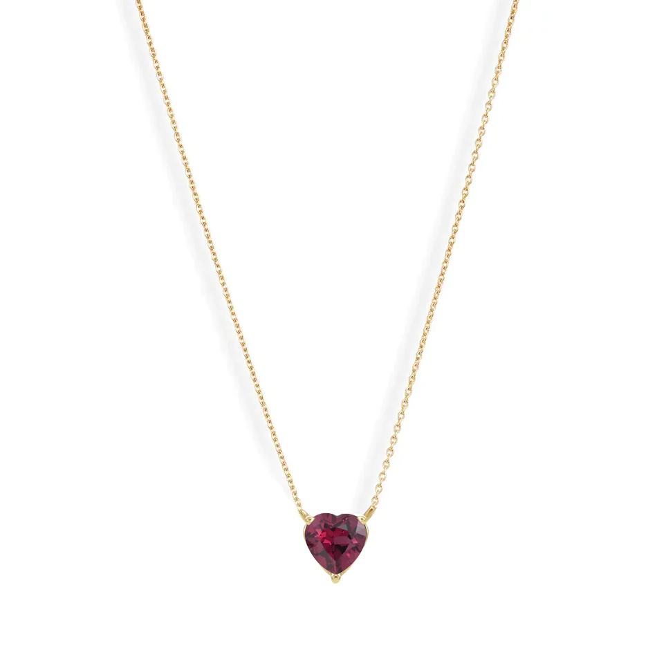 A vibrant heart shaped gemstone pendant on a dainty 14-karat gold chain. 