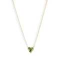 A vibrant heart shaped gemstone pendant on a dainty 14-karat gold chain. 