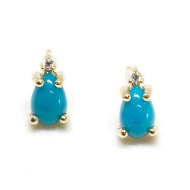 A Pair of pear-shaped turquoise cabochons set in 14-karat solid gold with a tiny diamond at the tip 