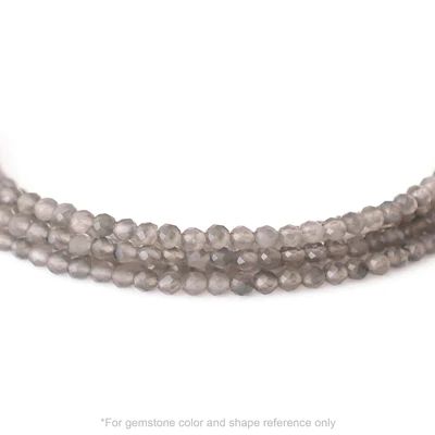Strung 'Wrap' Slate moonstone gemstone bead necklace with attached / integrated charm clasp.
Anne Sportun tag charm, and beaded charm included.