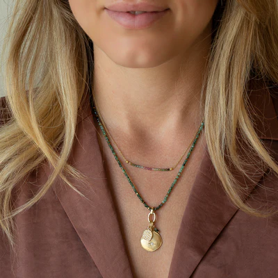 Strung 'Wrap'  gemstone bead necklace with attached / integrated charm clasp.
Anne Sportun tag charm, and beaded charm included. on model