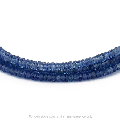 Strung 'Wrap' Blue Sapphire gemstone bead necklace with attached / integrated charm clasp.
Anne Sportun tag charm, and beaded charm included.