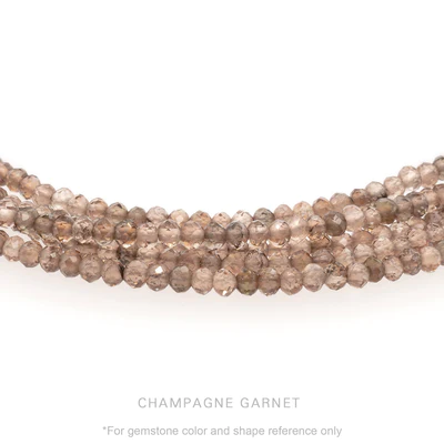 Strung 'Wrap' champagne garnet gemstone bead necklace with attached / integrated charm clasp.
Anne Sportun tag charm, and beaded charm included.