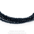 Strung 'Wrap' opaque Blue sapphire gemstone bead necklace with attached / integrated charm clasp.
Anne Sportun tag charm, and beaded charm included.