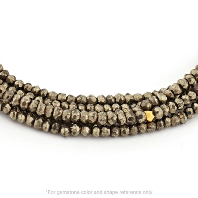 Strung 'Wrap' pyrite gemstone bead necklace with attached / integrated charm clasp.
Anne Sportun tag charm, and beaded charm included. 