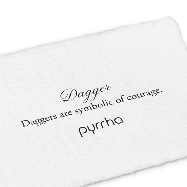 14ky Dagger Charm | Magpie Jewellery | Cursive text reading &quot;Dagger&quot; over serif font reading &quot;Daggers are symbolic of courage.&quot;
