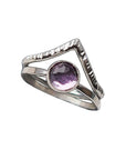 Two rings: a finely textured silver ring with a pointed chevron, and a hammered silver band set with an amethyst. 